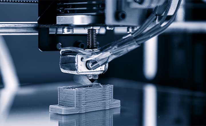 Close-up image of an additive manufacturing machine